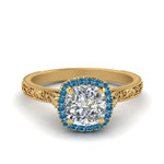 Load image into Gallery viewer, hand-engraved-cushion-cut-halo-diamond-engagement-ring-with-blue-topaz-in-yellow-gold-FD8588CURGICBLTO-NL-YG?v=1757588306
