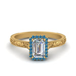 Load image into Gallery viewer, hand-engraved-emerald-cut-halo-diamond-engagement-ring-with-blue-topaz-in-yellow-gold-FD8588EMRGICBLTO-NL-YG_c233241e-fb8b-48ff-8cac-80c354c7464f?v=1757588497
