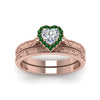 Load image into Gallery viewer, hand-engraved-heart-shaped-halo-diamond-wedding-ring-set-with-emerald-in-rose-gold-FD8588HTGEMGRANGLE5-NL-RG_76293f8b-c198-44a1-9172-3d49ab2f9798?v=1757665339