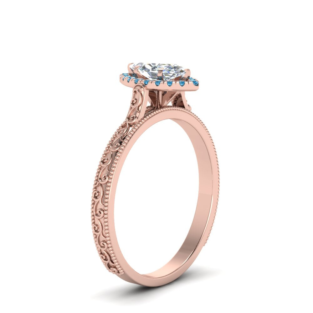 hand-engraved-marquise-cut-halo-diamond-engagement-ring-with-blue-topaz-in-rose-gold-FD8588MQRGICBLTOANGLE2-NL-RG_e5a72534-2c09-4a9d-b66a-dc1ed34e2b43?v=1757588521