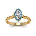 Load image into Gallery viewer, hand-engraved-marquise-cut-halo-diamond-engagement-ring-with-blue-topaz-in-yellow-gold-FD8588MQRGICBLTOANGLE5-NL-YG_669e3eff-55a1-4a35-8d02-5975b6c375df?v=1757588520
