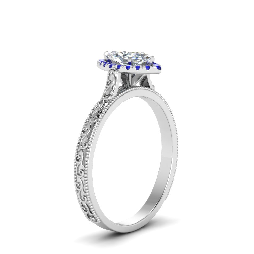 hand-engraved-marquise-cut-halo-diamond-engagement-ring-with-sapphire-in-white-gold-FD8588MQRGSABLANGLE2-NL-WG_339b854f-0c5d-4151-9090-2d488c5115f5?v=1757588520