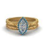 Load image into Gallery viewer, hand-engraved-marquise-cut-halo-diamond-wedding-ring-set-with-blue-topaz-in-yellow-gold-FD8588MQGICBLTO-NL-YG_daa5f8ba-e751-43b2-ada2-2f4cecab3bd9?v=1757665350
