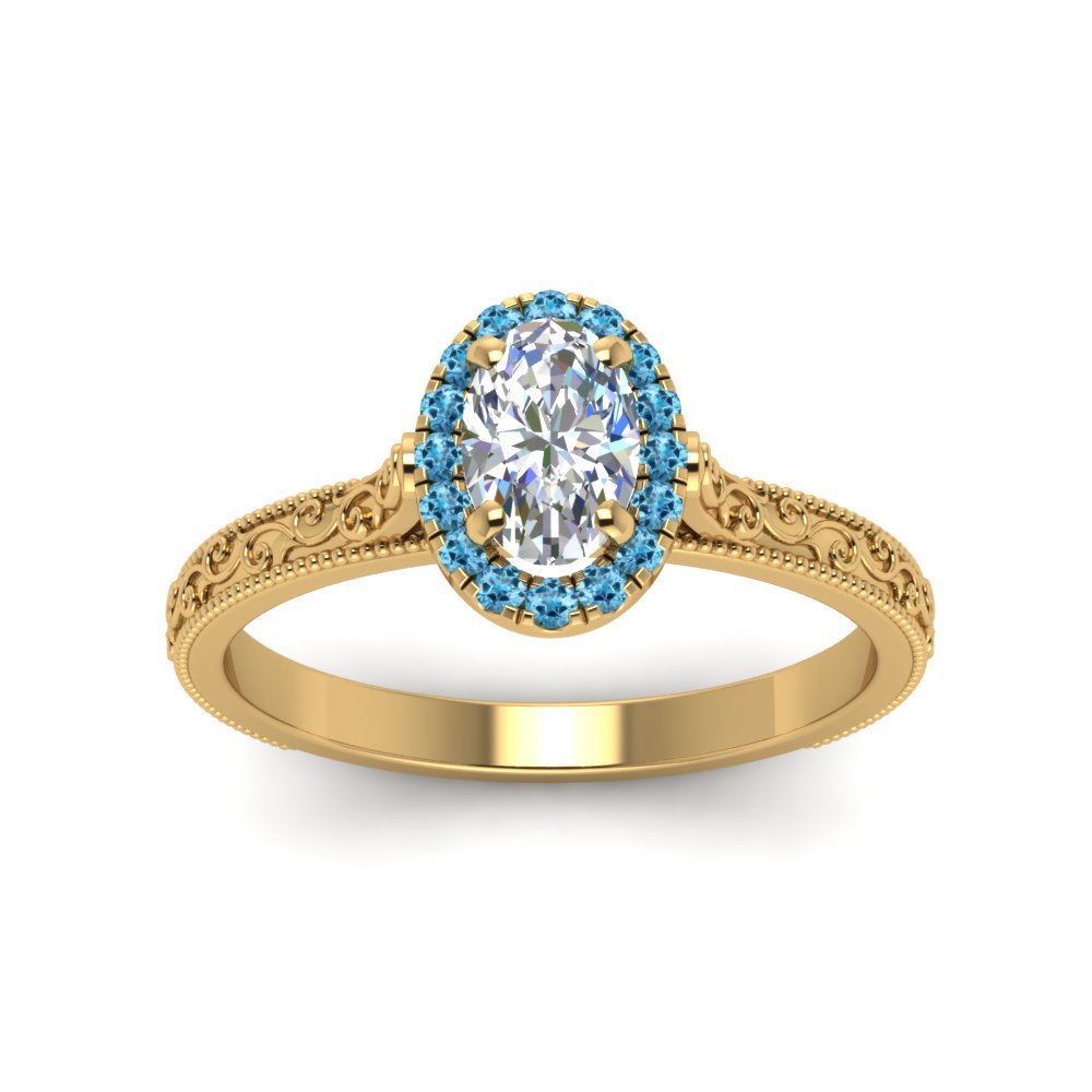 hand-engraved-oval-shaped-halo-diamond-engagement-ring-with-blue-topaz-in-yellow-gold-FD8588OVRGICBLTOANGLE5-NL-YG?v=1757588385