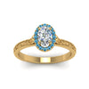Load image into Gallery viewer, hand-engraved-oval-shaped-halo-diamond-engagement-ring-with-blue-topaz-in-yellow-gold-FD8588OVRGICBLTOANGLE5-NL-YG_1a420a9b-c888-486c-840f-881c78074d20?v=1757588531