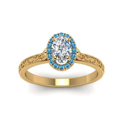 hand-engraved-oval-shaped-halo-diamond-engagement-ring-with-blue-topaz-in-yellow-gold-FD8588OVRGICBLTOANGLE5-NL-YG_1a420a9b-c888-486c-840f-881c78074d20?v=1757588531