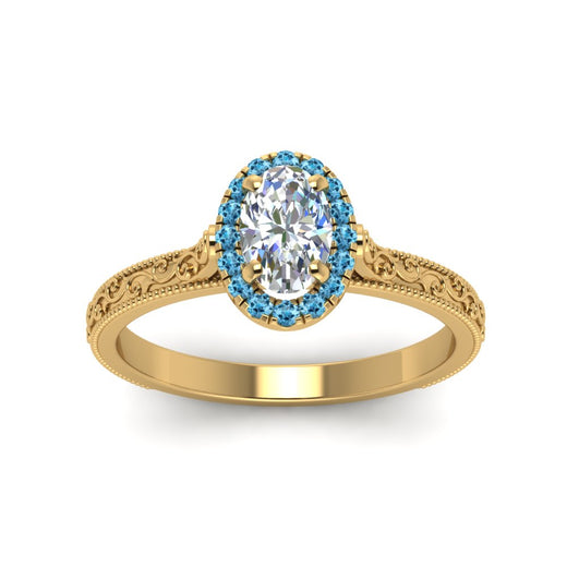 hand-engraved-oval-shaped-halo-diamond-engagement-ring-with-blue-topaz-in-yellow-gold-FD8588OVRGICBLTOANGLE5-NL-YG_1a420a9b-c888-486c-840f-881c78074d20?v=1757588531