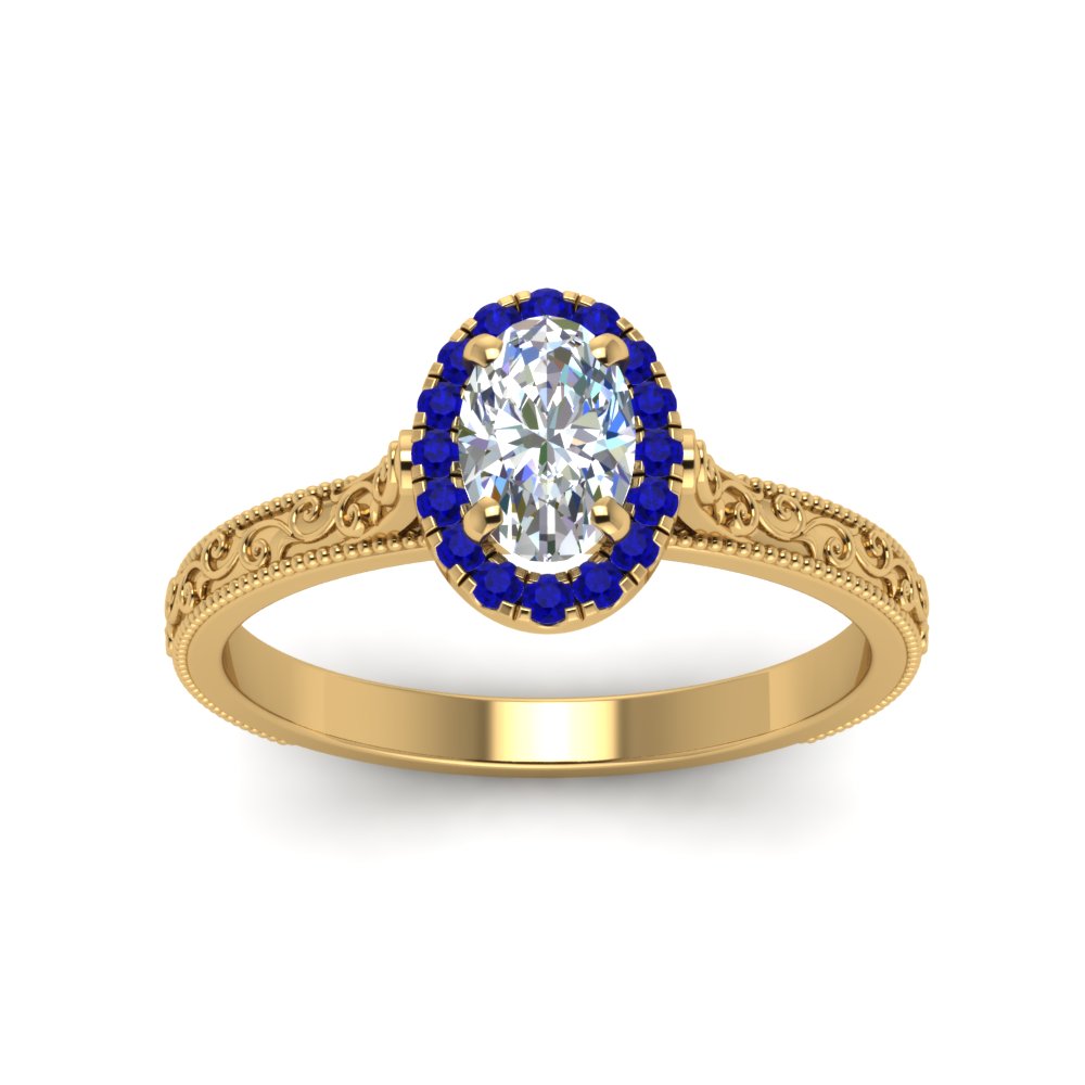 hand-engraved-oval-shaped-halo-diamond-engagement-ring-with-sapphire-in-yellow-gold-FD8588OVRGSABLANGLE5-NL-YG?v=1757588384