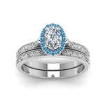 Load image into Gallery viewer, hand-engraved-oval-shaped-halo-diamond-wedding-ring-set-with-blue-topaz-in-white-gold-FD8588OVGICBLTOANGLE5-NL-WG?v=1757665222
