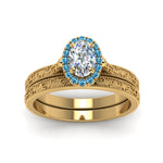 Load image into Gallery viewer, hand-engraved-oval-shaped-halo-diamond-wedding-ring-set-with-blue-topaz-in-yellow-gold-FD8588OVGICBLTOANGLE5-NL-YG?v=1757665223