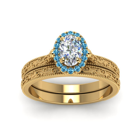hand-engraved-oval-shaped-halo-diamond-wedding-ring-set-with-blue-topaz-in-yellow-gold-FD8588OVGICBLTOANGLE5-NL-YG?v=1757665223