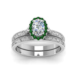 Load image into Gallery viewer, hand-engraved-oval-shaped-halo-diamond-wedding-ring-set-with-emerald-in-white-gold-FD8588OVGEMGRANGLE5-NL-WG_74ca1b20-0266-4f5f-9d48-f807e7b1223e?v=1757665361
