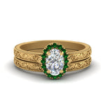 Load image into Gallery viewer, hand-engraved-oval-shaped-halo-diamond-wedding-ring-set-with-emerald-in-yellow-gold-FD8588OVGEMGR-NL-YG_b4c5f582-4581-49f0-9338-49c5468c6503?v=1757665362
