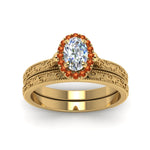 Load image into Gallery viewer, hand-engraved-oval-shaped-halo-diamond-wedding-ring-set-with-orange-sapphire-in-yellow-gold-FD8588OVGSAORANGLE5-NL-YG_f02bd134-9978-451f-9a9e-44ede03427f1?v=1757665361
