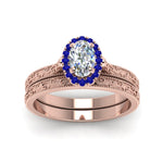 Load image into Gallery viewer, hand-engraved-oval-shaped-halo-diamond-wedding-ring-set-with-sapphire-in-rose-gold-FD8588OVGSABLANGLE5-NL-RG_1574c64f-ca73-4315-94c8-a126eb2ceaf0?v=1757665361
