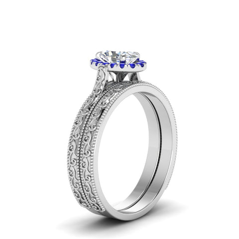 hand-engraved-oval-shaped-halo-diamond-wedding-ring-set-with-sapphire-in-white-gold-FD8588OVGSABLANGLE2-NL-WG?v=1757665222