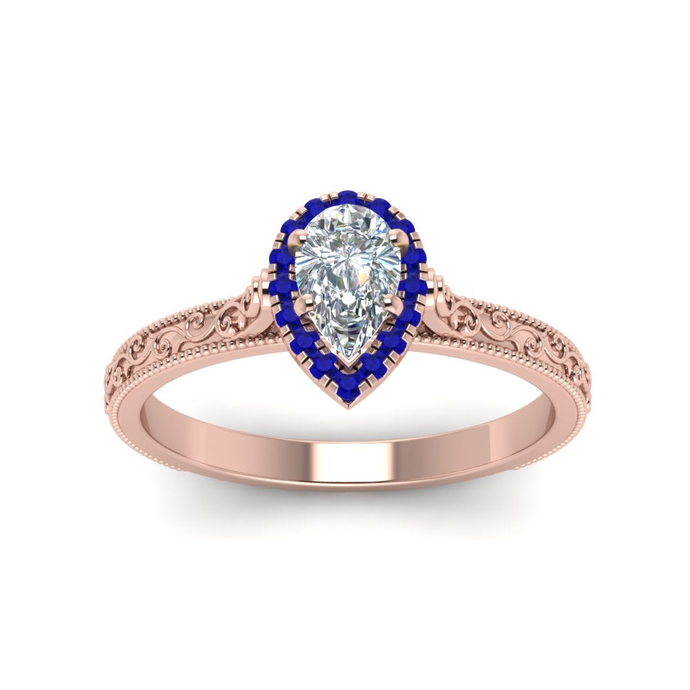 hand-engraved-pear-shaped-halo-diamond-engagement-ring-with-sapphire-in-rose-gold-FD8588PERGSABLANGLE5-NL-RG_e336e348-4921-4a32-97ca-37dc9d67cbe8?v=1757588542