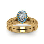 Load image into Gallery viewer, hand-engraved-pear-shaped-halo-diamond-wedding-ring-set-with-blue-topaz-in-yellow-gold-FD8588PEGICBLTOANGLE5-NL-YG?v=1757665239
