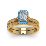 Load image into Gallery viewer, hand-engraved-radiant-cut-halo-diamond-wedding-ring-set-with-blue-topaz-in-yellow-gold-FD8588RAGICBLTOANGLE5-NL-YG_efa8824b-2f14-474d-b89b-21a00c3dc36c?v=1757665393
