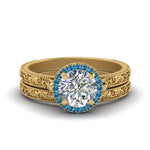Load image into Gallery viewer, hand-engraved-round-cut-halo-diamond-wedding-ring-set-with-blue-topaz-in-yellow-gold-FD8588ROGICBLTO-NL-YG_7cf2d0ea-585a-4c6f-b546-a13c805171d2?v=1757665404
