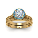 Load image into Gallery viewer, hand-engraved-round-cut-halo-diamond-wedding-ring-set-with-blue-topaz-in-yellow-gold-FD8588ROGICBLTOANGLE5-NL-YG_c3a54d38-4fed-4f3e-b29d-7d1d41e63267?v=1757665404
