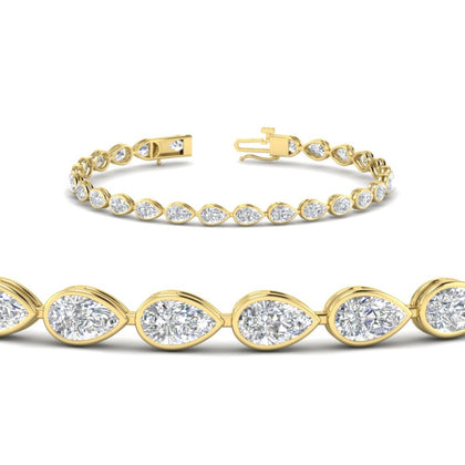 handcrafted-bezel-set-pear-diamond-bracelet-in-yellow-gold-FDBRCPE10581ANGLE2-6.50CT-NL-YG_6d941e5a-3d0e-4049-8413-0c8f41f752ac.jpg?v=1776851151