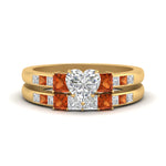 Load image into Gallery viewer, heart-shaped-channel-three-stone-diamond-engagement-ring-with-orange-sapphire-in-yellow-gold-FDENS205HTGSAOR-NL-YG.jpg
