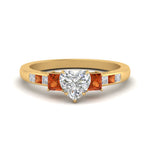 Load image into Gallery viewer, heart-shaped-channel-three-stone-diamond-engagement-ring-with-orange-sapphire-in-yellow-gold-FDENS205HTRGSAOR-NL-YG.jpg
