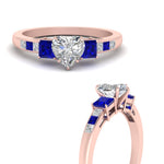 Load image into Gallery viewer, heart-shaped-channel-three-stone-diamond-engagement-ring-with-sapphire-in-rose-gold-FDENS205HTRGSABL-NL-RG.jpg
