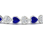 Load image into Gallery viewer, heart-shaped-diamond-bezel-tennis-bracelet-10-40-carat-with-sapphire-in-white-gold-fdbrc10581htgsablangle2-10-40-ct-nl-wg
