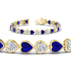 Load image into Gallery viewer, heart-shaped-diamond-bezel-tennis-bracelet-10-40-carat-with-sapphire-in-yellow-gold-fdbrc10581htgsablangle2-10-40-ct-nl-yg