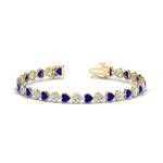 Load image into Gallery viewer, heart-shaped-diamond-bezel-tennis-bracelet-7-75-carat-with-sapphire-in-yellow-gold-fdbrc10581htgsablangle2-7-75-ct-nl-yg
