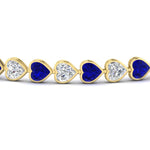Load image into Gallery viewer, heart-shaped-diamond-bezel-tennis-bracelet-7-75-carat-with-sapphire-in-yellow-gold-fdbrc10581htgsablangle2-7-75-ct-nl-yg
