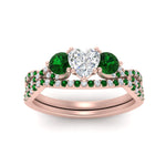 Load image into Gallery viewer, heart-shaped-twisted-floral-prong-emerald-wedding-set-in-rose-gold-FD10257HTGEMGR-ANGLE5-NL-RG_d5de954d-5459-4b3a-a2a3-0b6ede0bc082?v=1756360128
