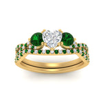 Load image into Gallery viewer, heart-shaped-twisted-floral-prong-emerald-wedding-set-in-yellow-gold-FD10257HTGEMGR-ANGLE5-NL-YG?v=1756359990
