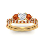 Load image into Gallery viewer, heart-shaped-twisted-floral-prong-orange-sapphire-wedding-set-in-yellow-gold-FD10257HTGSAOR-ANGLE5-NL-YG_97d3c632-5803-41d2-8e56-54e1db2604d7?v=1756360128
