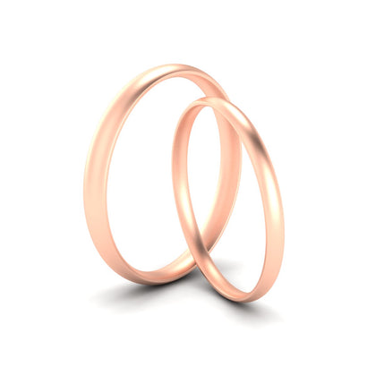 his-and-hers-curved-wedding-rings-in-rose-gold-fdm10521angle2-nl-rg