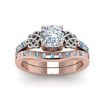 Load image into Gallery viewer, irish-cushion-cut-diamond-bridal-ring-set-with-blue-topaz-in-rose-gold-FDENS2255B4CUGICBLTOANGLE5-NL-RG_0d76fa46-6a7b-4efe-a3f5-e4ce00a1b113?v=1757052278
