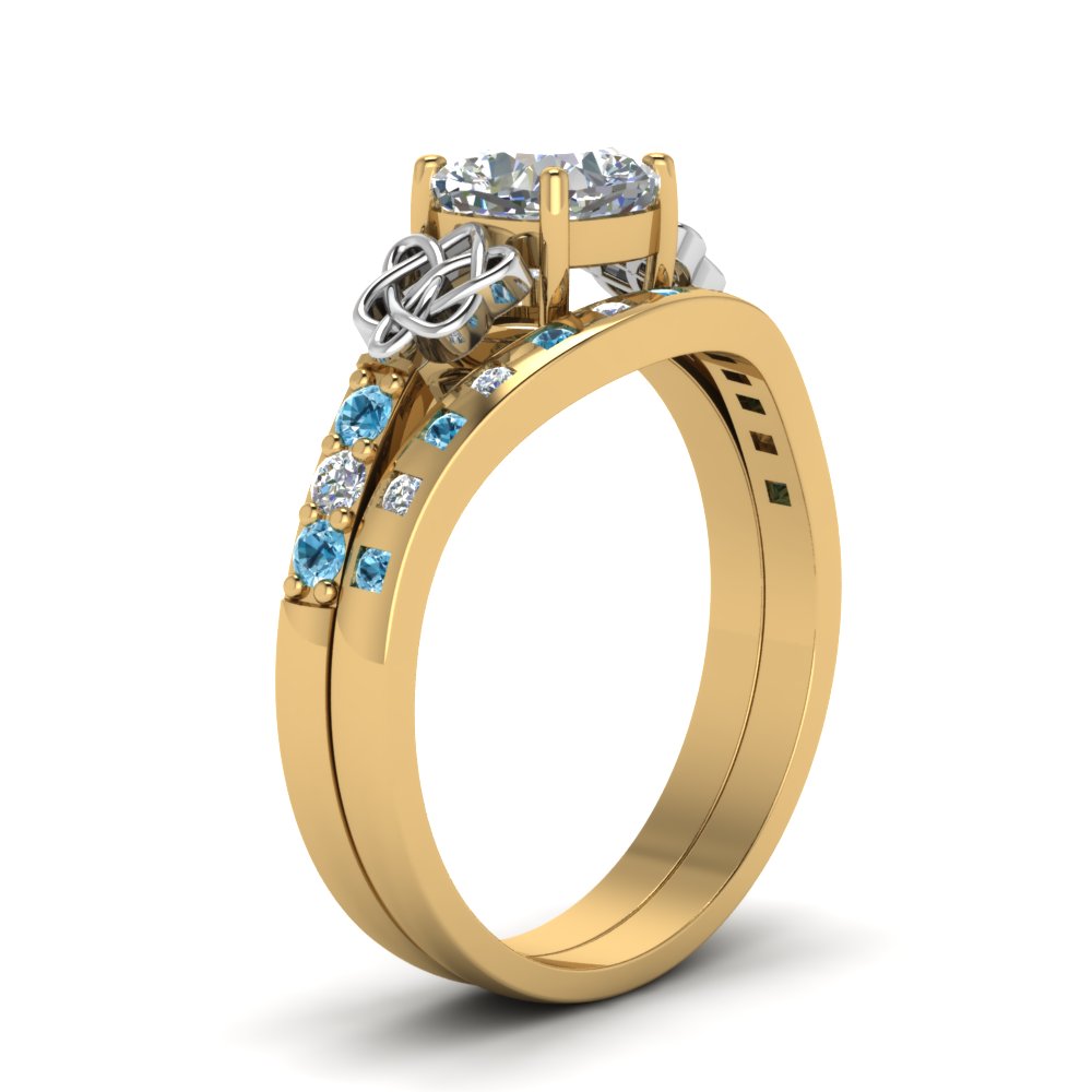 irish-cushion-cut-diamond-bridal-ring-set-with-blue-topaz-in-yellow-gold-FDENS2255B4CUGICBLTOANGLE2-NL-YG_a0fd101f-8f4f-43c4-9c2d-c022e1abaa8c?v=1757052278