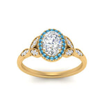 Load image into Gallery viewer, leaves-oval-shaped-halo-diamond-engagement-ring-with-blue-topaz-in-yellow-gold-FD9827OVRGICBLTOANGLE5-NL-YG.jpg?v=1770891254