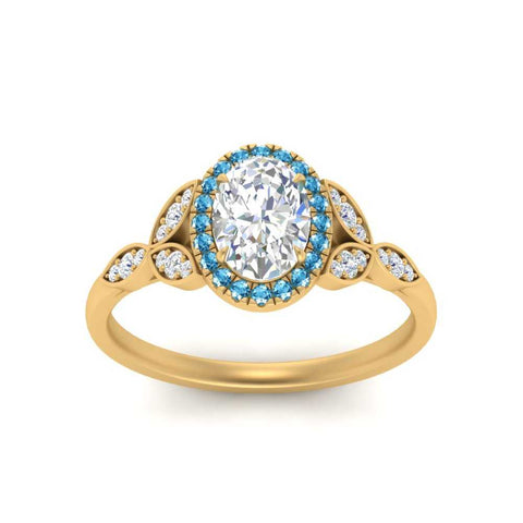 leaves-oval-shaped-halo-diamond-engagement-ring-with-blue-topaz-in-yellow-gold-FD9827OVRGICBLTOANGLE5-NL-YG_d9f50a22-49a2-48f2-96ce-31b2869e89ce.jpg?v=1770891378