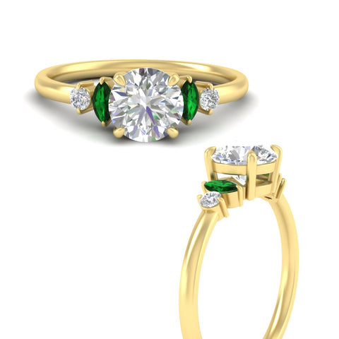 marquise-and-round-accented-emerald-engagement-ring-in-yellow-gold-fdenr11621rogemgrangle3-nl-yg.jpg?v=1766474362