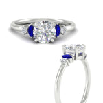 Load image into Gallery viewer, marquise-and-round-accented-sapphire-engagement-ring-in-white-gold-fdenr11621rogsablangle3-nl-wg_55b58a4f-9996-4b4f-a79f-42a1a38639cc.jpg?v=1764757354
