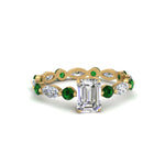 Load image into Gallery viewer, marquise-and-round-eternity-emerald-cut-diamond-engagement-ring-with-emerald-in-yellow-gold-FDEWB9398EMRGEMGR-NL-YG.jpg?v=1756456495
