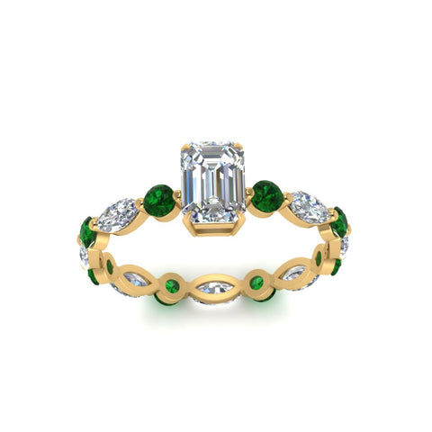 marquise-and-round-eternity-emerald-cut-diamond-engagement-ring-with-emerald-in-yellow-gold-FDEWB9398EMRGEMGRANGLE5-NL-YG.jpg?v=1756456494