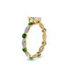 Load image into Gallery viewer, marquise-and-round-eternity-marquise-cut-diamond-engagement-ring-with-emerald-in-yellow-gold-FDEWB9398MQRGEMGRANGLE2-NL-YG_0cffd80c-8c14-4675-b952-1a48c2b66586.jpg?v=1756456662