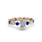 Load image into Gallery viewer, marquise-and-round-eternity-marquise-cut-diamond-engagement-ring-with-sapphire-in-yellow-gold-FDEWB9398MQRGSABL-NL-YG.jpg?v=1756456524
