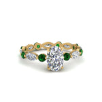 Load image into Gallery viewer, marquise-and-round-eternity-oval-shaped-diamond-engagement-ring-with-emerald-in-yellow-gold-FDEWB9398OVRGEMGR-NL-YG_da27c926-b2da-4efd-be51-e1a6514c9e07.jpg?v=1756456674
