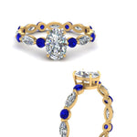 Load image into Gallery viewer, marquise-and-round-eternity-oval-shaped-diamond-engagement-ring-with-sapphire-in-yellow-gold-FDEWB9398OVRGSABLANGLE3-NL-YG_a7ce0dc0-7883-444f-ae79-03087fe3a18f.jpg?v=1756456673
