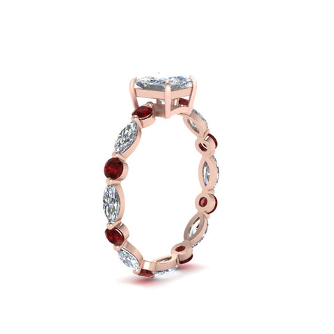 marquise-and-round-eternity-princess-cut-diamond-engagement-ring-with-ruby-in-rose-gold-FDEWB9398PRRGRUDRANGLE2-NL-RG.jpg?v=1756456571